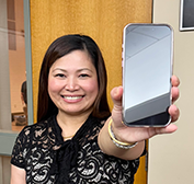 Hand holding up a smartphone